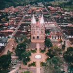 an aerial view of a city with a clock tower