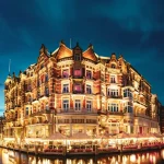 landmark photo of building beside body of water